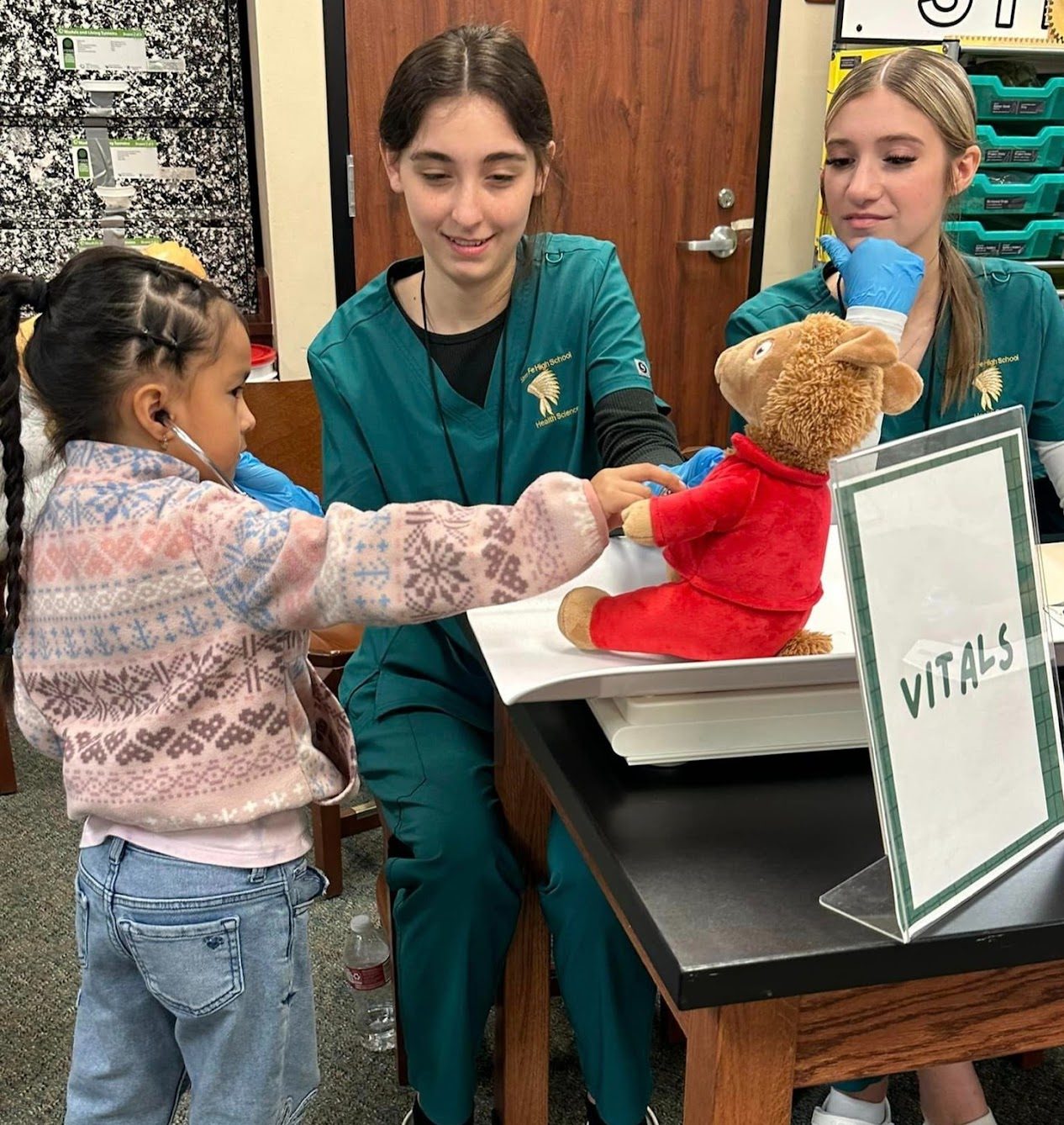 Individual student clinic with teddy bears and patients.