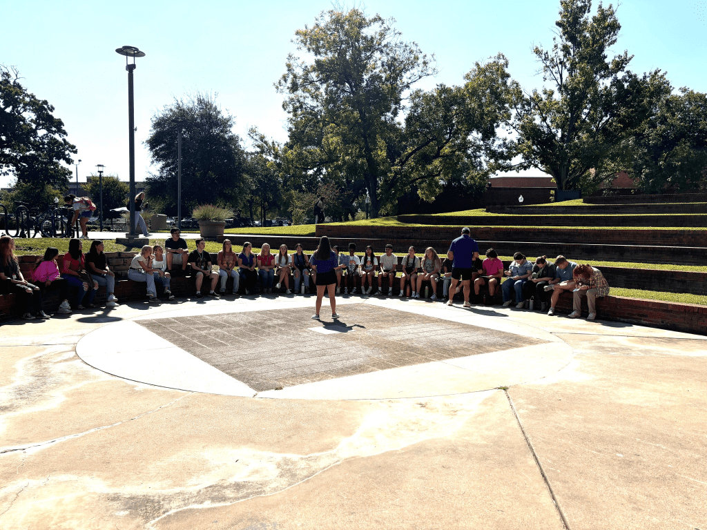 students listening to tour guide