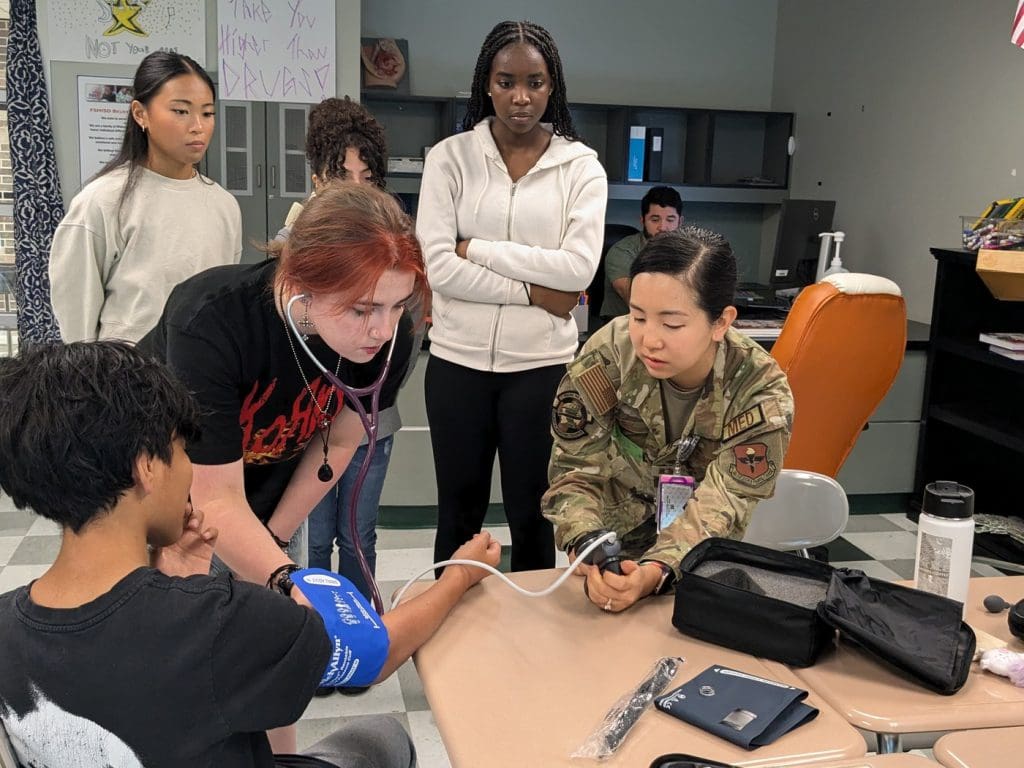 students interacting with tools on career day