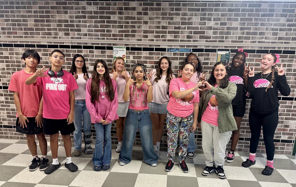 students wearing pink for breast cancer awareness